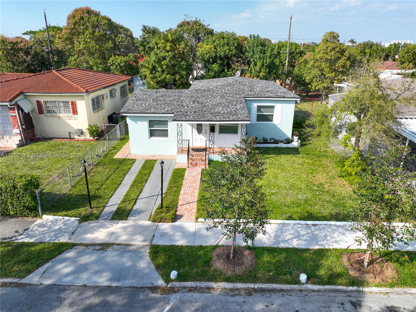 5571 Southwest 5th Terrace Miami, FL 33134 - Photo 32 of 37 a front view of a house with a yard