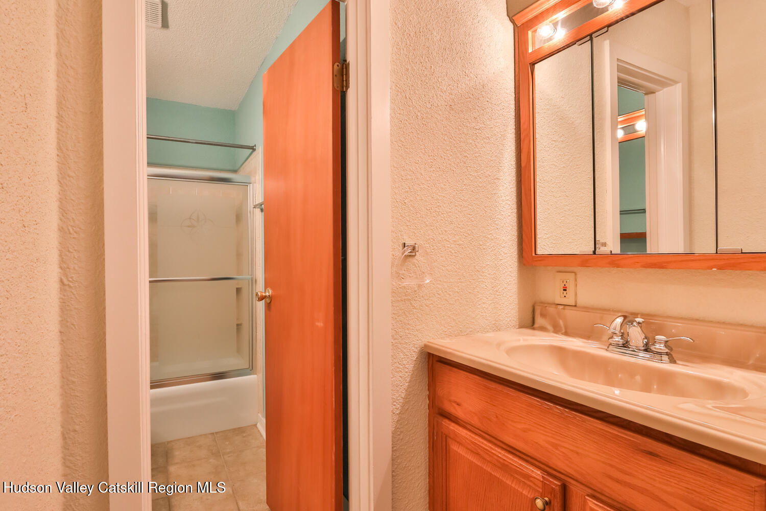 33 Scribner Hollow Road, Unit E4 Hunter, NY 12442 - Photo 24 of 44 a bathroom with a sink and a mirror