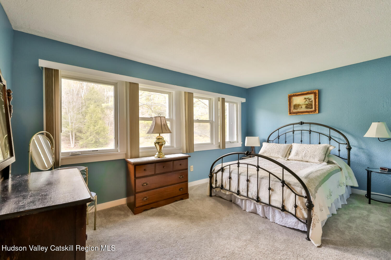 33 Scribner Hollow Road, Unit E4 Hunter, NY 12442 - Photo 27 of 44 a bedroom with a bed chairs and a window