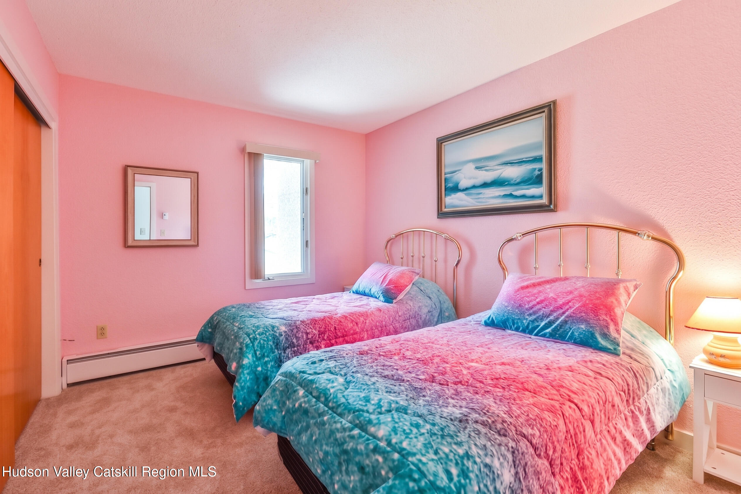33 Scribner Hollow Road, Unit E4 Hunter, NY 12442 - Photo 29 of 44 a bedroom with three beds and a painting