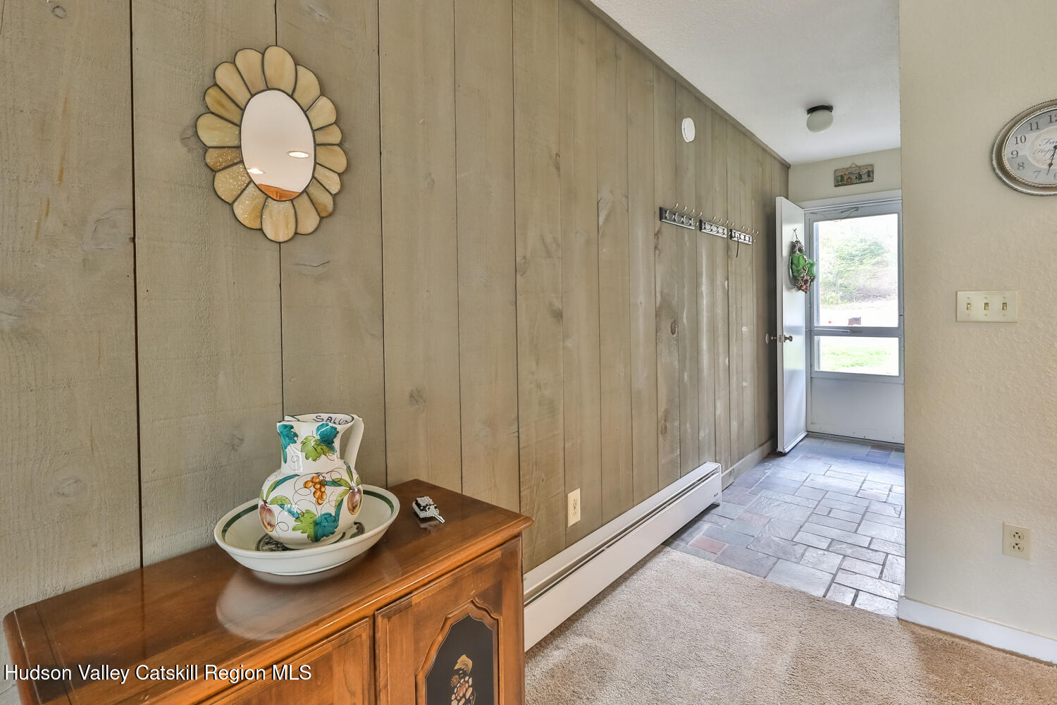 33 Scribner Hollow Road, Unit E4 Hunter, NY 12442 - Photo 5 of 44 a table and a vase of flowers sitting on a dining table