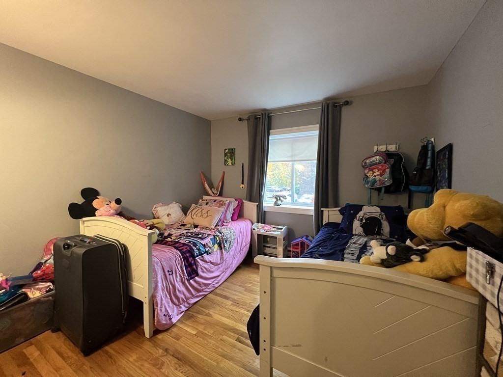 1 Universal Street, Unit 7 Framingham, MA 01702 - Photo 14 of 23 a bed room with two bed and a large window