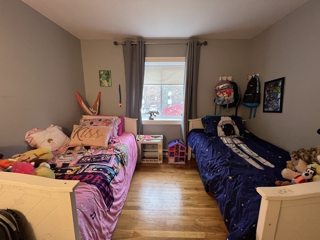 1 Universal Street, Unit 7 Framingham, MA 01702 - Photo 15 of 23 a bed sitting in a bedroom next to a window