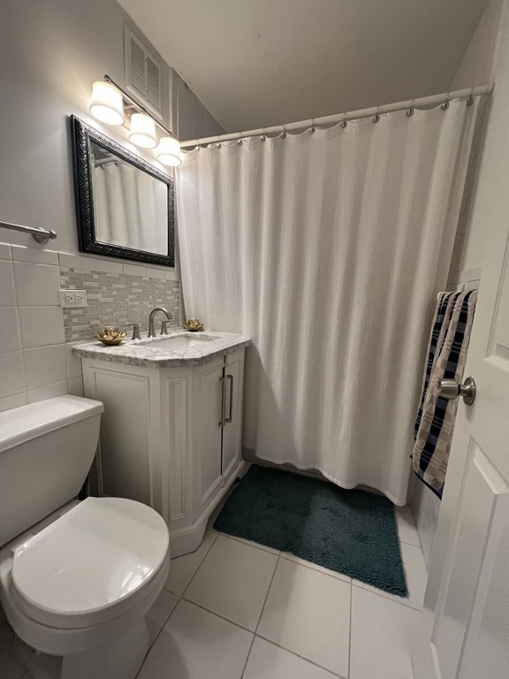 1 Universal Street, Unit 7 Framingham, MA 01702 - Photo 17 of 23 a bathroom with a sink toilet and shower