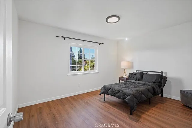 a bedroom with bed and a window