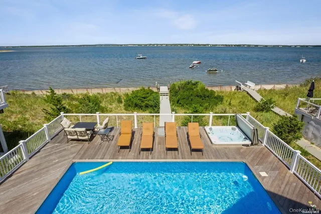 a view of swimming pool with seating area