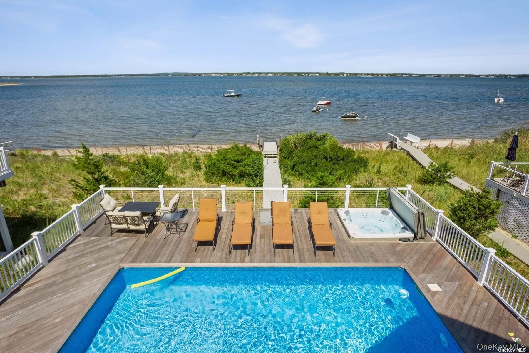 676 Dune Road West Hampton Dunes, NY 11978 - Photo 16 of 20 a view of swimming pool with seating area