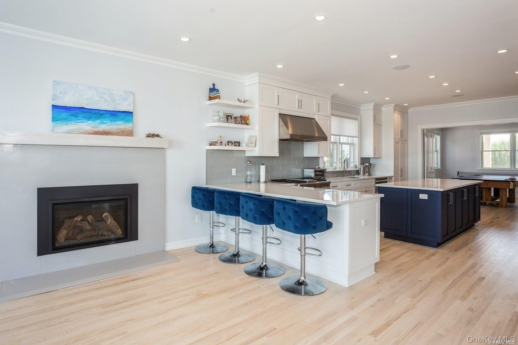 676 Dune Road West Hampton Dunes, NY 11978 - Photo 5 of 20 a kitchen with stainless steel appliances kitchen island granite countertop a stove a sink and a refrigerator