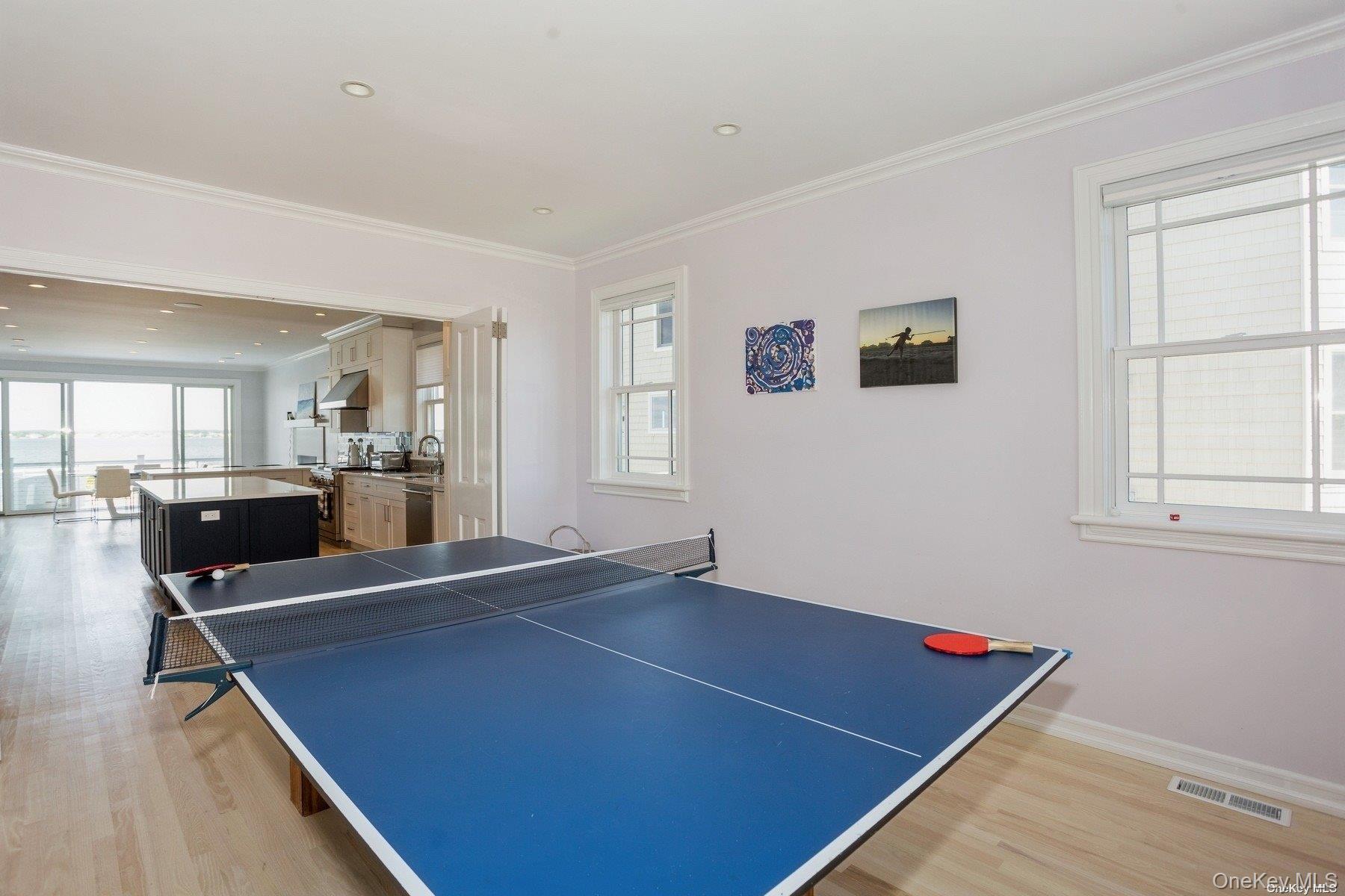676 Dune Road West Hampton Dunes, NY 11978 - Photo 8 of 20 a room with pool table and windows