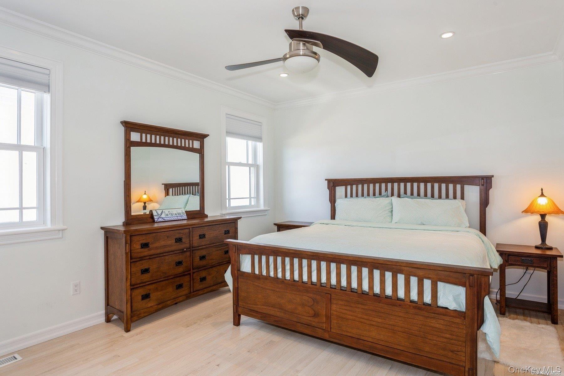 676 Dune Road West Hampton Dunes, NY 11978 - Photo 9 of 20 a bedroom with a bed and a dresser