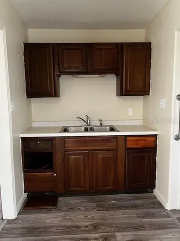 a view of a livingroom with a ceiling fan and window