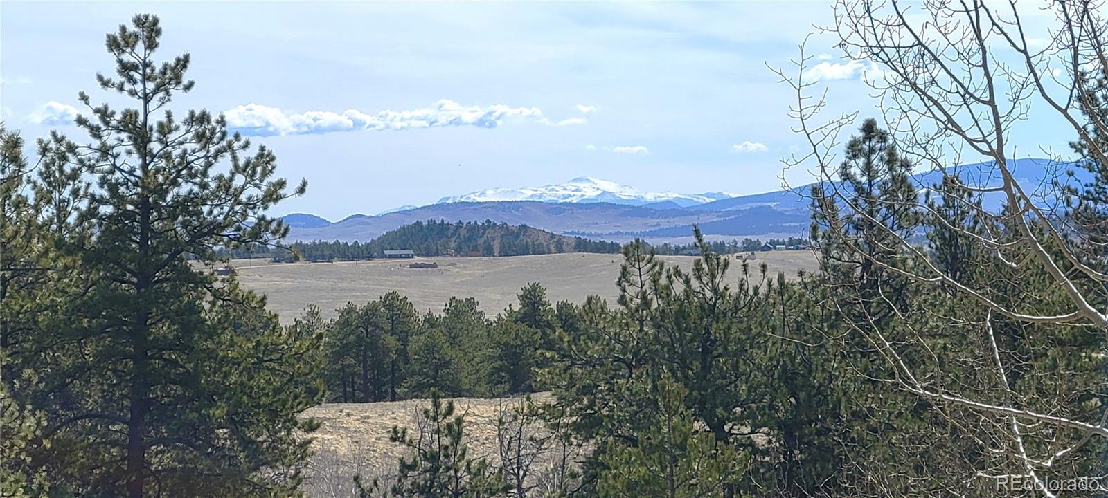 5076 Campfire Road Hartsel, CO 80449 - Photo 13 of 35 a view of a lake with a mountain in the background