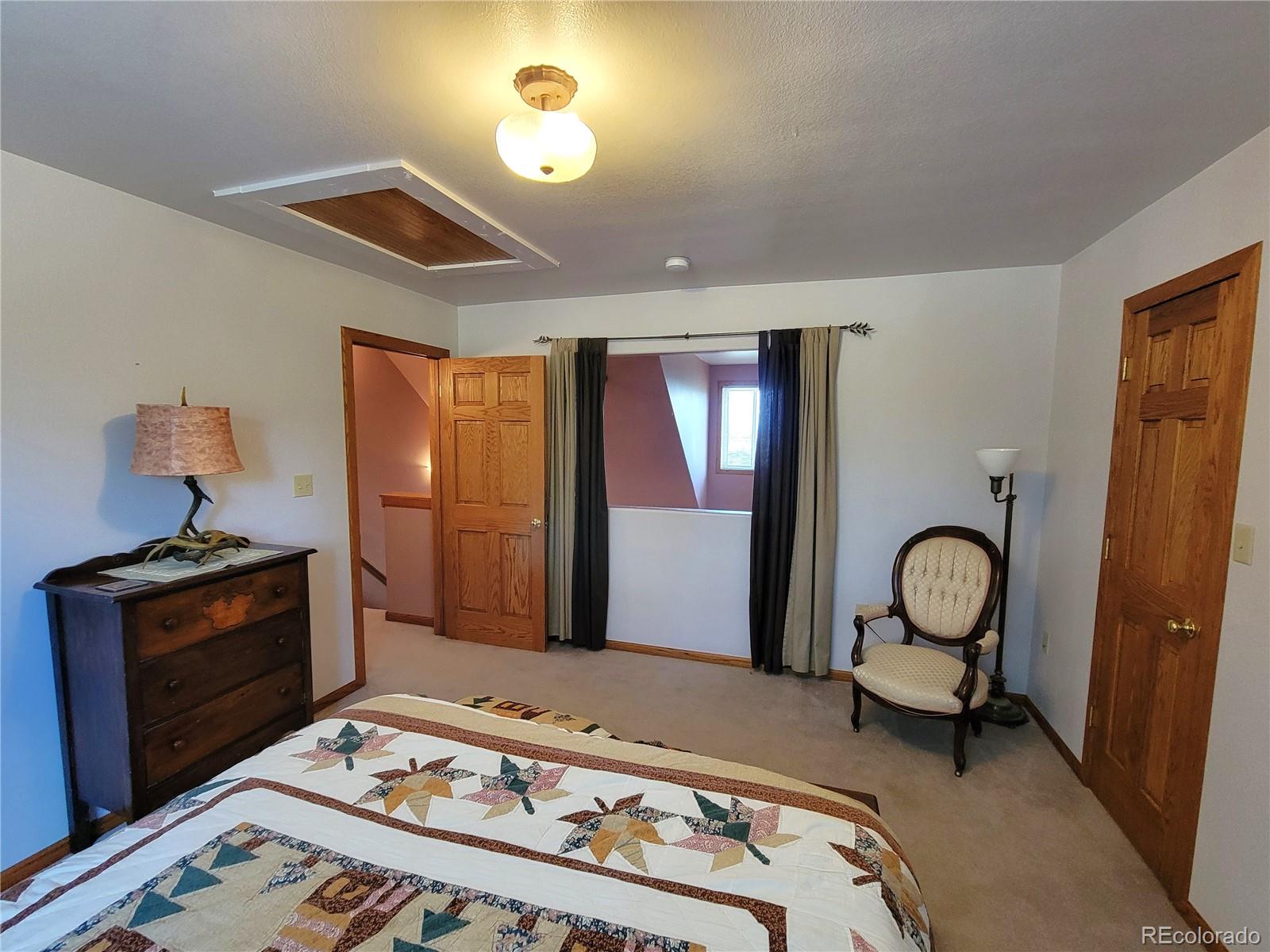 5076 Campfire Road Hartsel, CO 80449 - Photo 16 of 35 a bedroom with furniture and a window