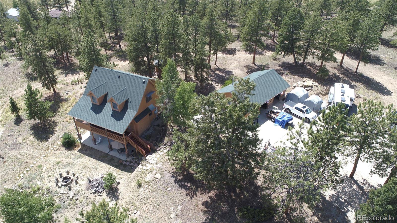 5076 Campfire Road Hartsel, CO 80449 - Photo 2 of 35 an aerial view of a house with a yard