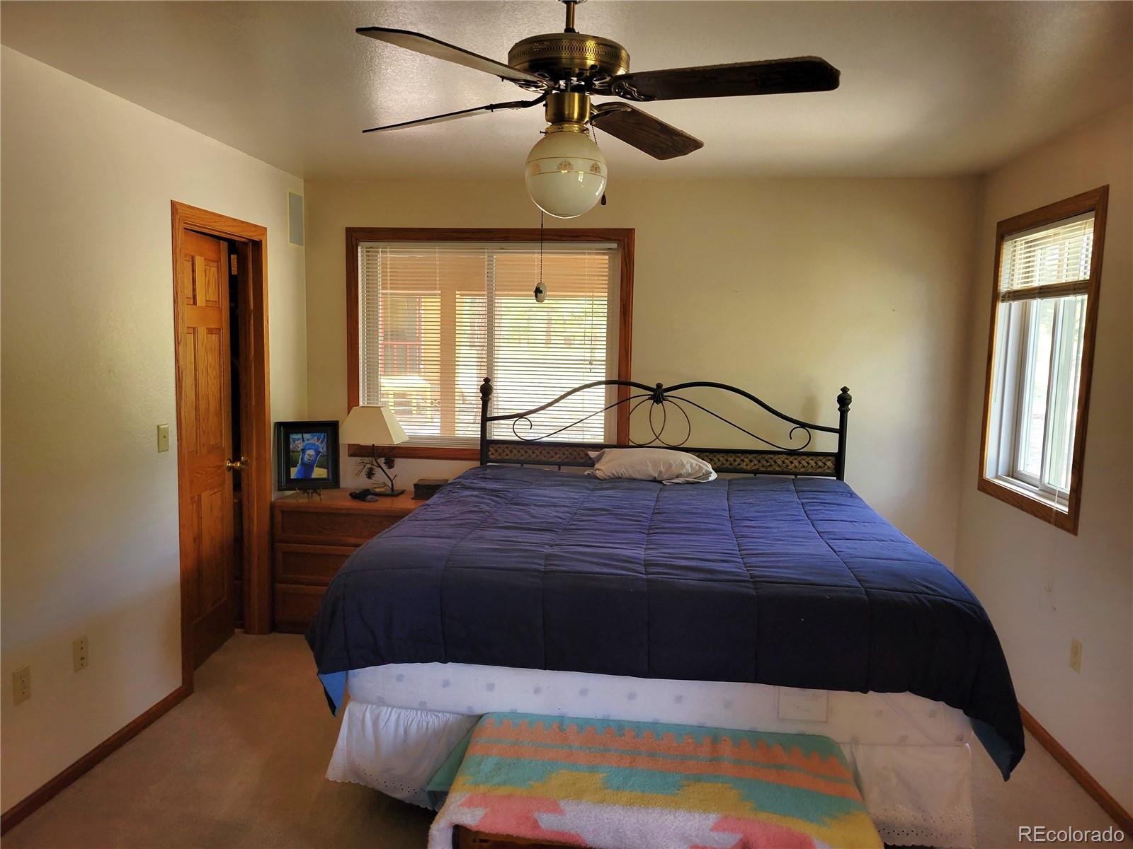 5076 Campfire Road Hartsel, CO 80449 - Photo 8 of 35 a bedroom with a bed and window