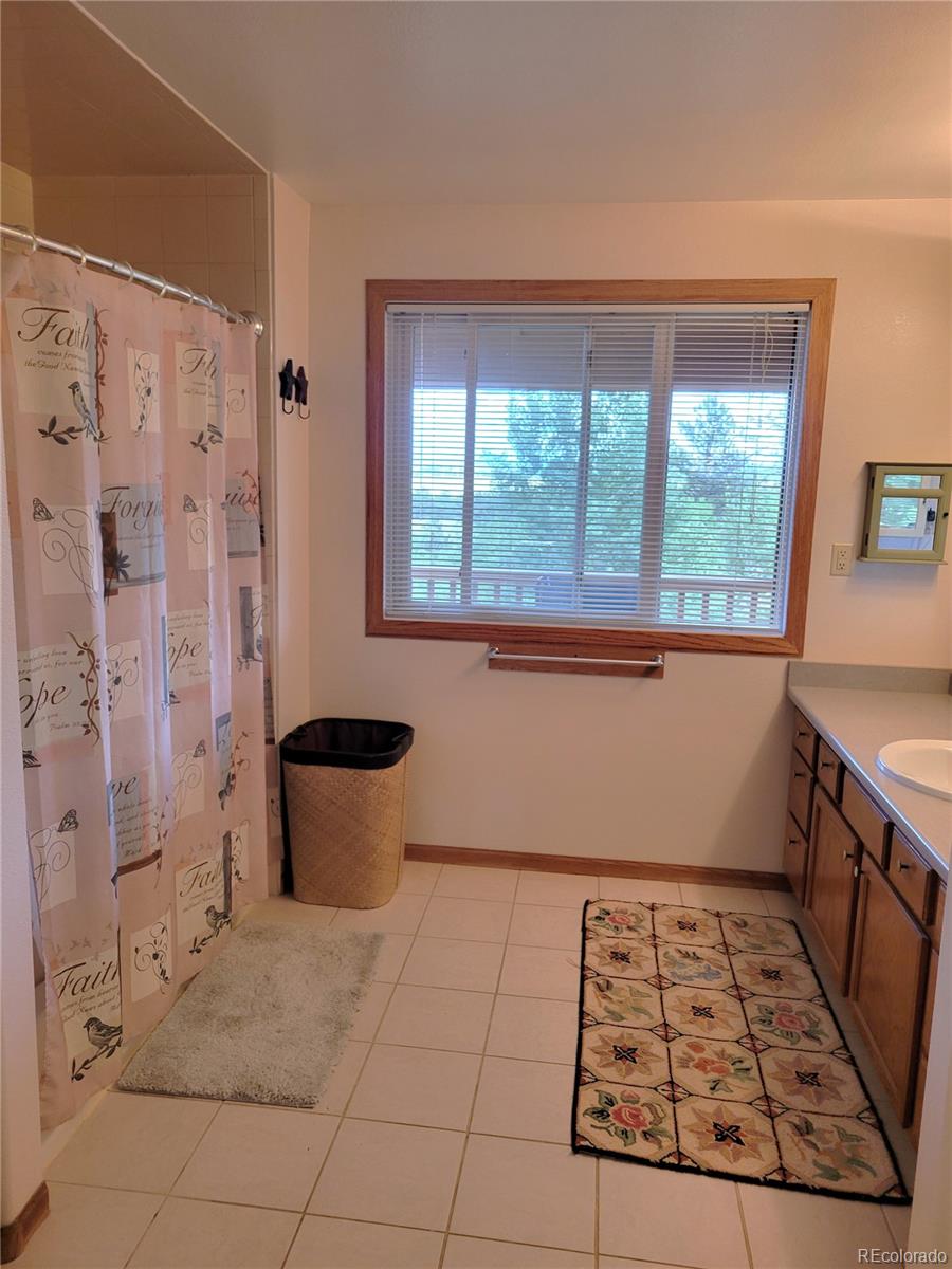 5076 Campfire Road Hartsel, CO 80449 - Photo 10 of 35 a kitchen with a stove a sink and a refrigerator