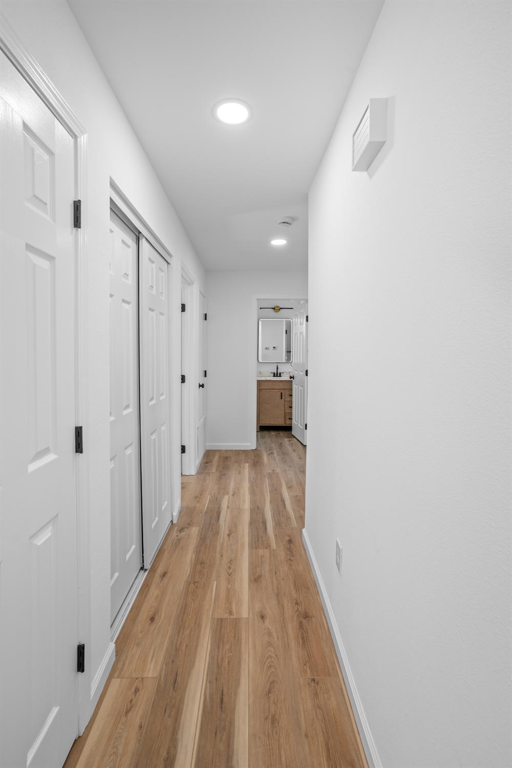 1509 Boothe Road Ceres, CA 95307 - Photo 16 of 28 a view of hallway with wooden floor
