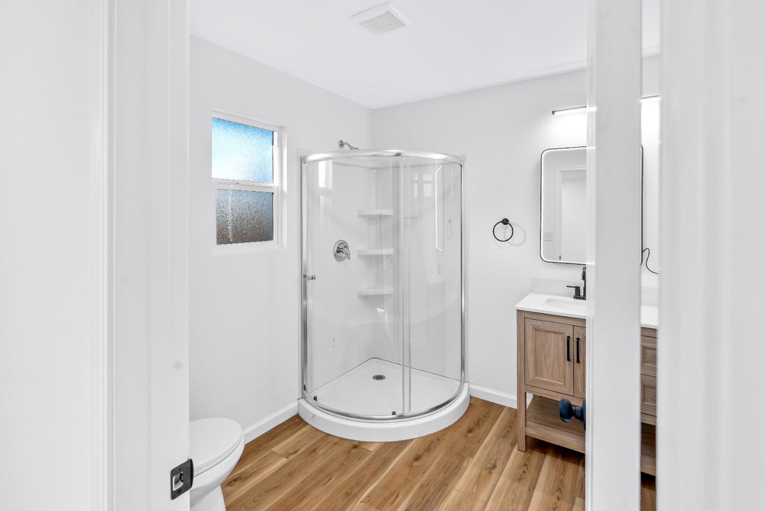 1509 Boothe Road Ceres, CA 95307 - Photo 21 of 28 a bathroom with a shower a sink and a mirror