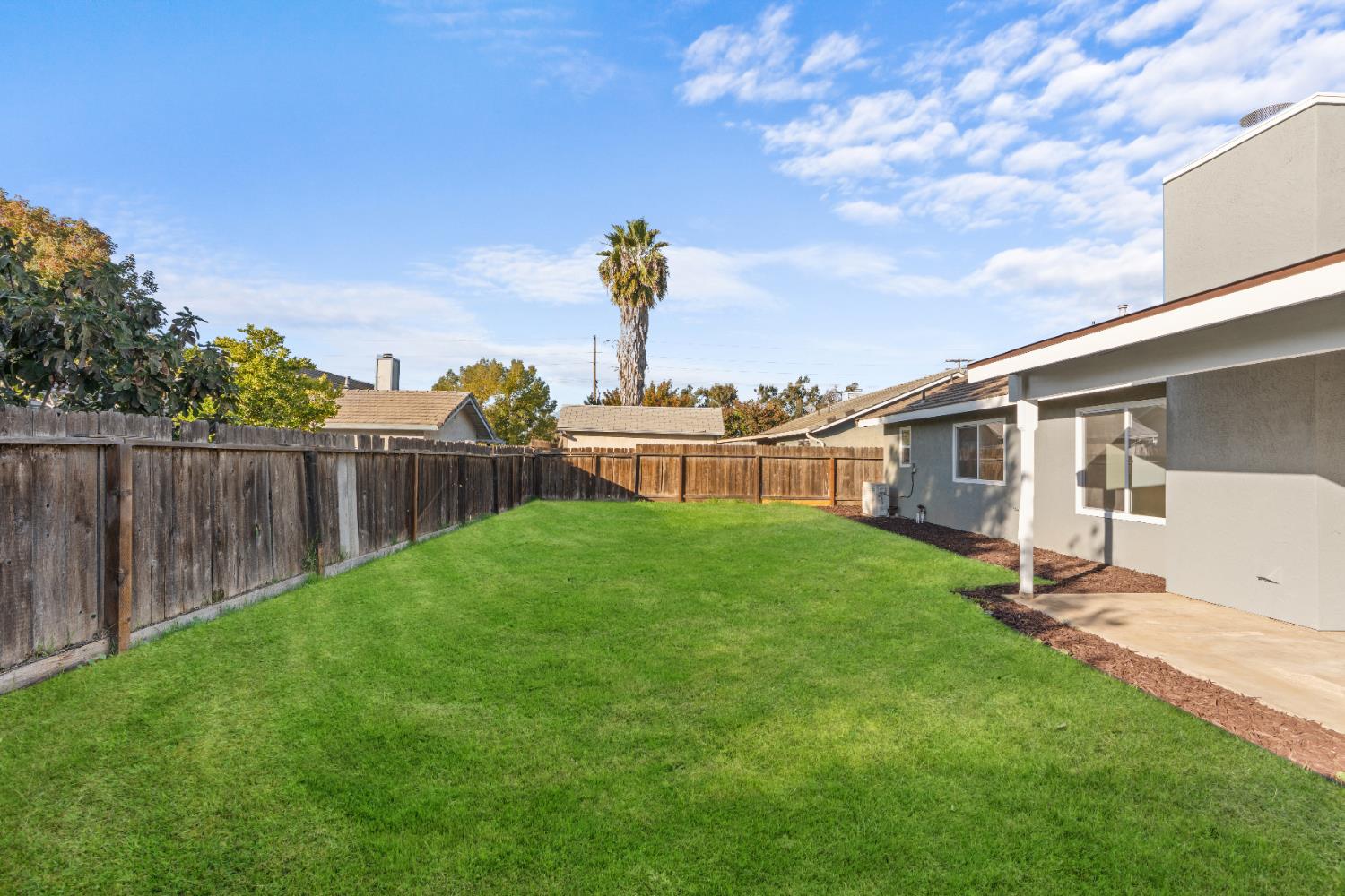 1509 Boothe Road Ceres, CA 95307 - Photo 26 of 28 a view of a backyard with a garden
