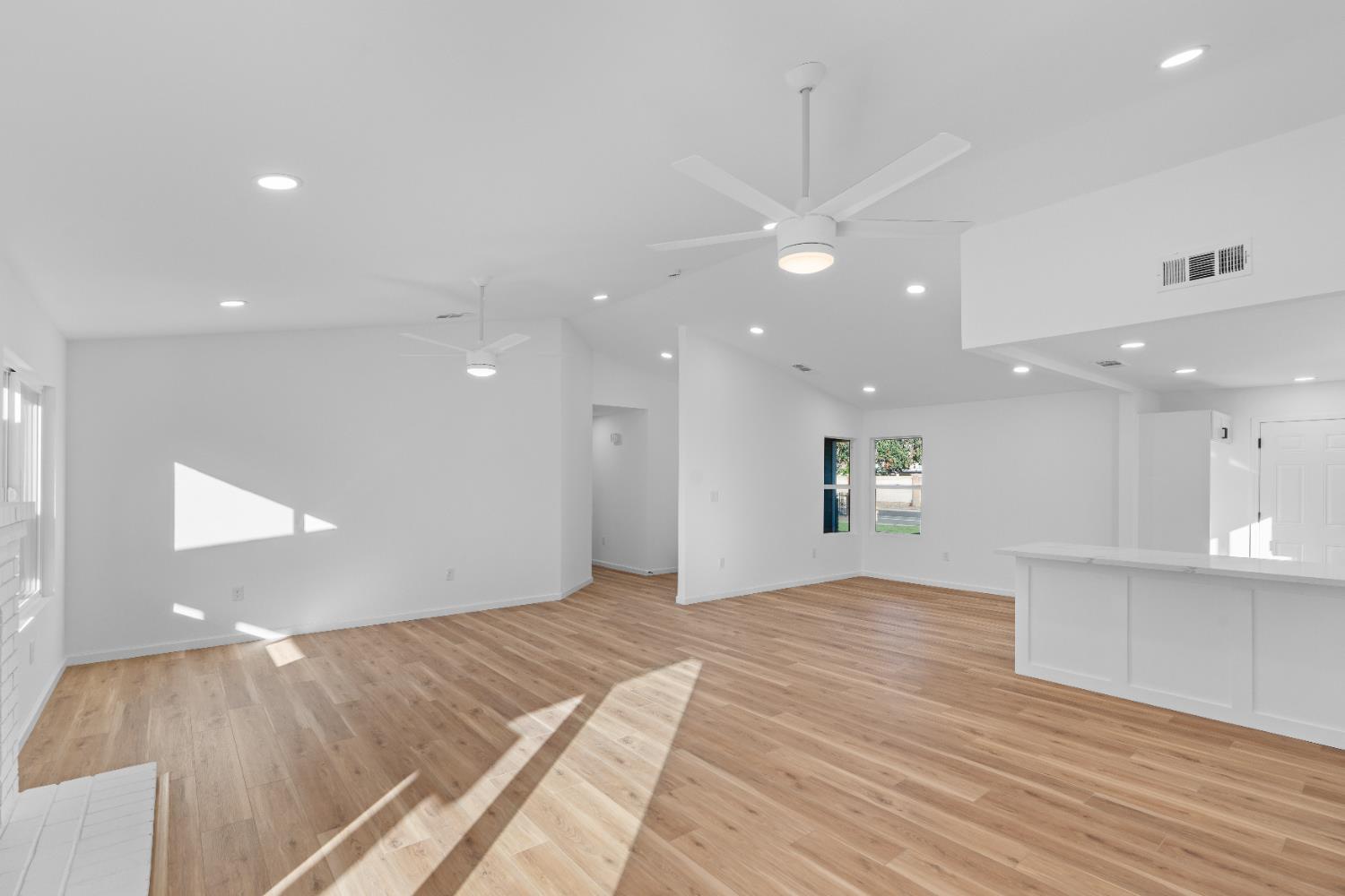 1509 Boothe Road Ceres, CA 95307 - Photo 8 of 28 a view of an empty room with kitchen and window