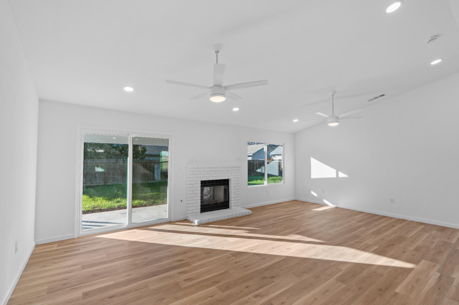 1509 Boothe Road Ceres, CA 95307 - Photo 9 of 28 a view of a livingroom with a staircase a fireplace and a window