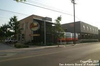 a view of a street with a building in the background