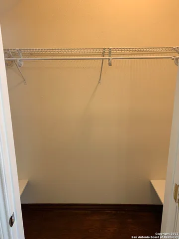 a view of a room with racks on the wall