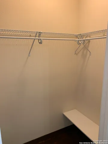 a view of wooden floor and cabinet