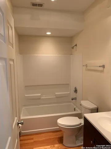 a bathroom with a toilet a sink and bathtub
