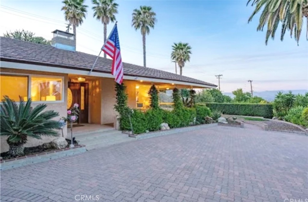 1 Cayuse Lane Rancho Palos Verdes, CA 90275 - Photo 2 of 28 a view of a patio with a table and chairs under an umbrella