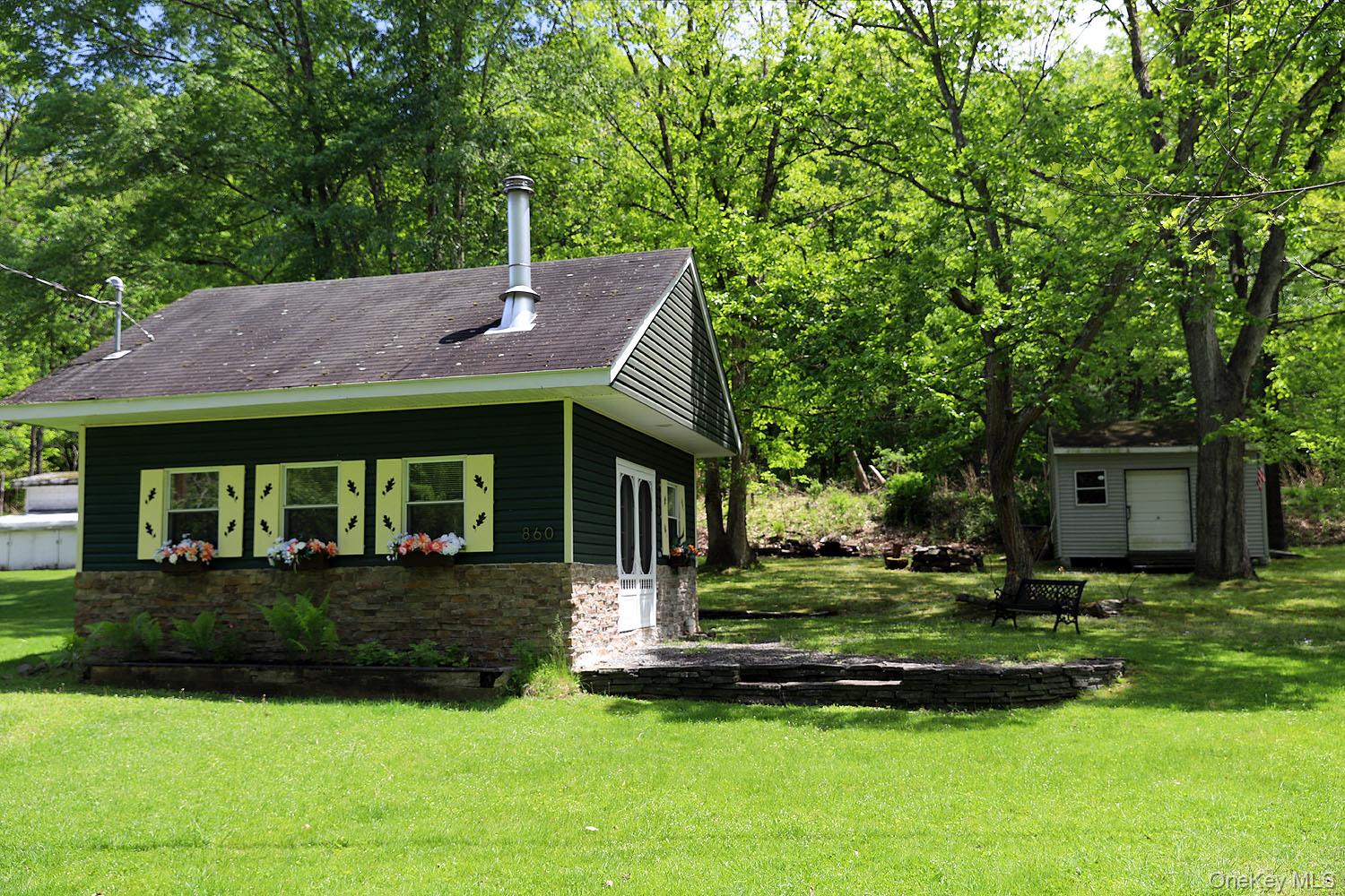860 River Road Callicoon, NY 12723 - Photo 34 of 45 a front view of a house with a yard