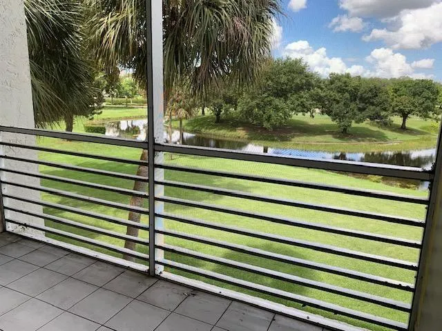 a view of a wooden fence and a floor to ceiling window