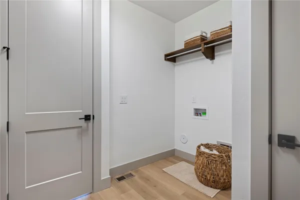a kitchen with a sink and refrigerator