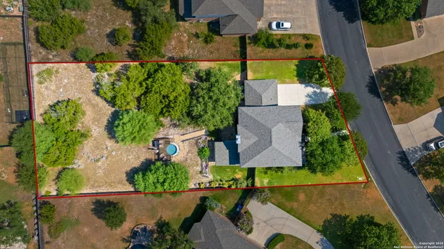 an aerial view of a house with a garden