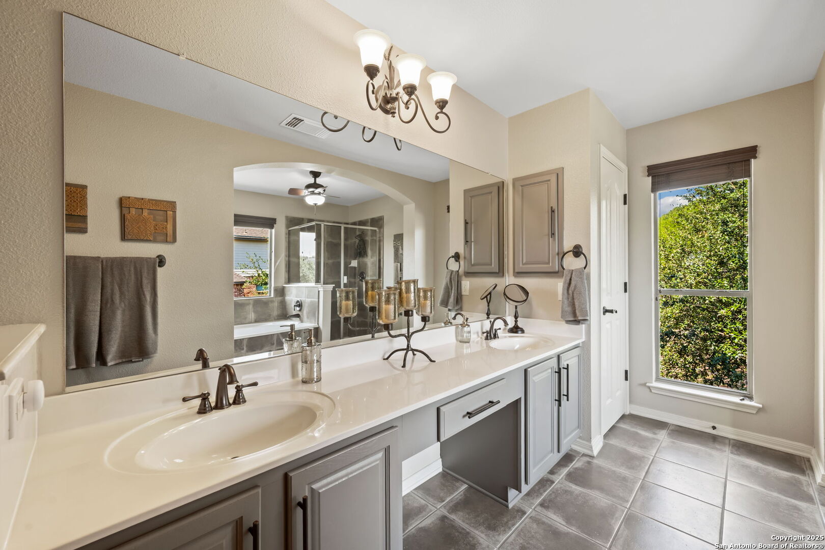 14507 John David Helotes, TX 78023 - Photo 13 of 49 a spacious bathroom with a sink and a mirror