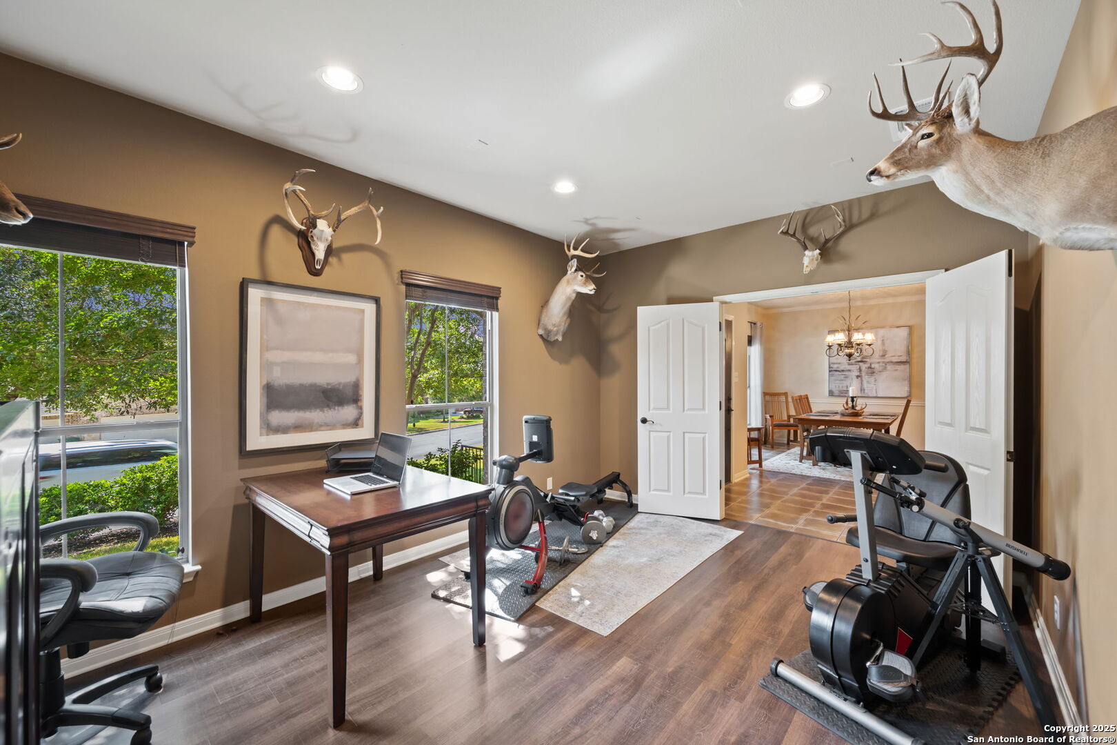14507 John David Helotes, TX 78023 - Photo 14 of 49 a living room with furniture a window and gym equipment