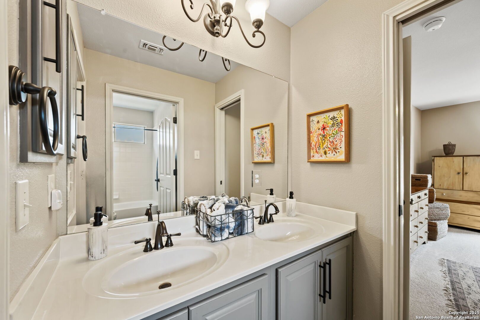 14507 John David Helotes, TX 78023 - Photo 18 of 49 a bathroom with a sink and a mirror