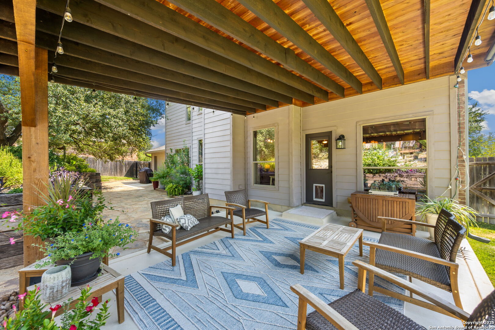 14507 John David Helotes, TX 78023 - Photo 20 of 49 a outdoor living space with furniture and garden view