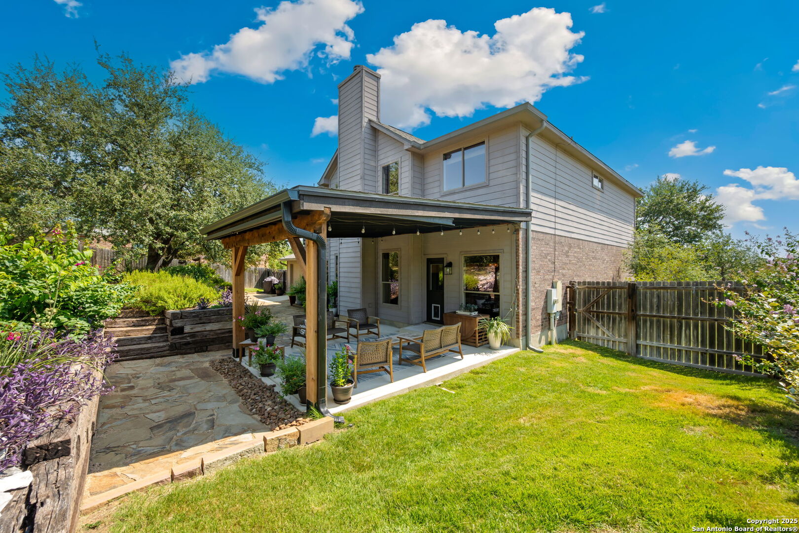 14507 John David Helotes, TX 78023 - Photo 22 of 49 a view of a house with a backyard porch and sitting area