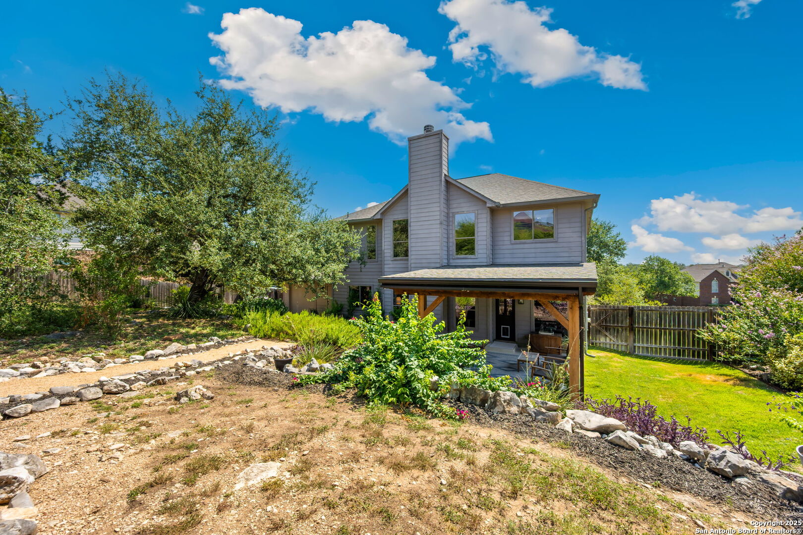 14507 John David Helotes, TX 78023 - Photo 23 of 49 a front view of a house with garden