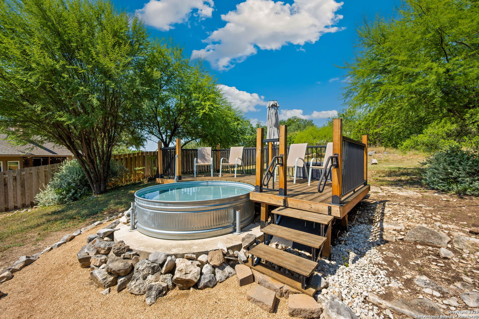 14507 John David Helotes, TX 78023 - Photo 24 of 49 a view of a house with backyard sitting area and garden