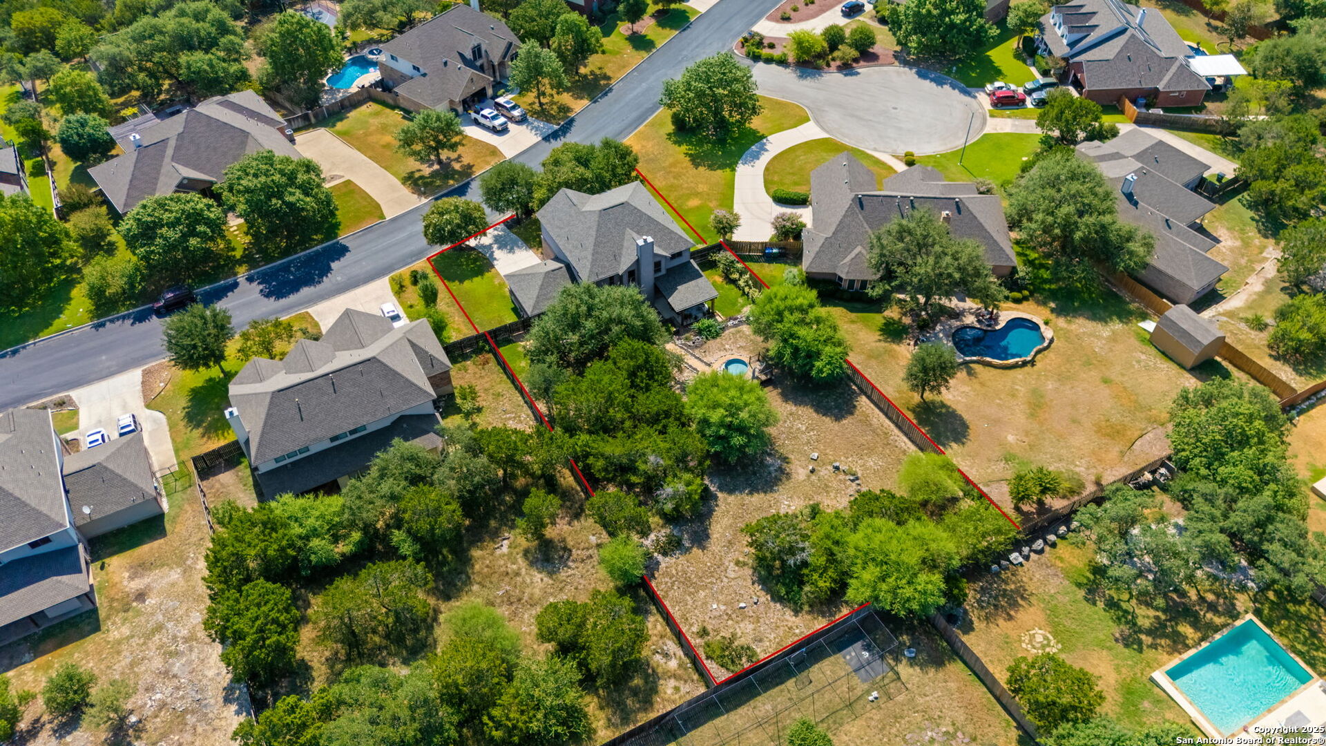 14507 John David Helotes, TX 78023 - Photo 29 of 49 an aerial view of residential house with outdoor space and swimming pool