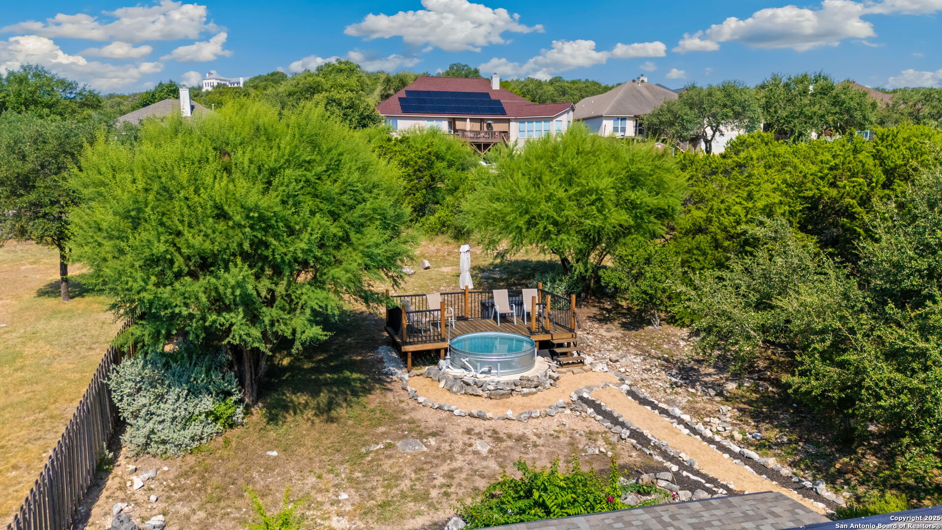 14507 John David Helotes, TX 78023 - Photo 31 of 49 a view of a backyard with plants and a patio