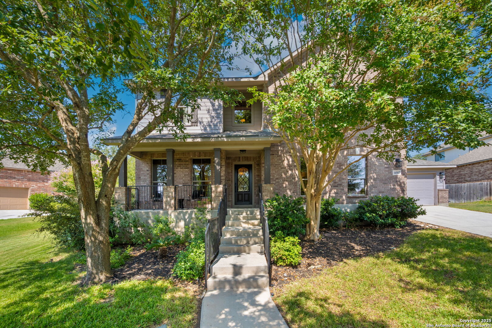 14507 John David Helotes, TX 78023 - Photo 32 of 49 a front view of a house with garden
