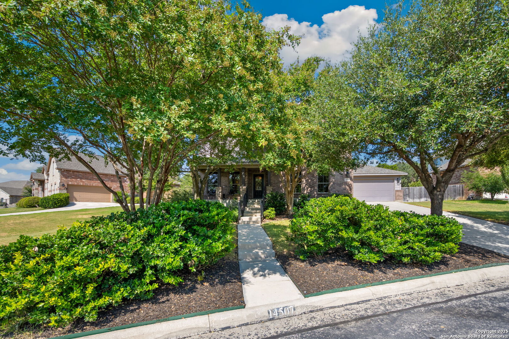 14507 John David Helotes, TX 78023 - Photo 4 of 49 front view of a house with a tree