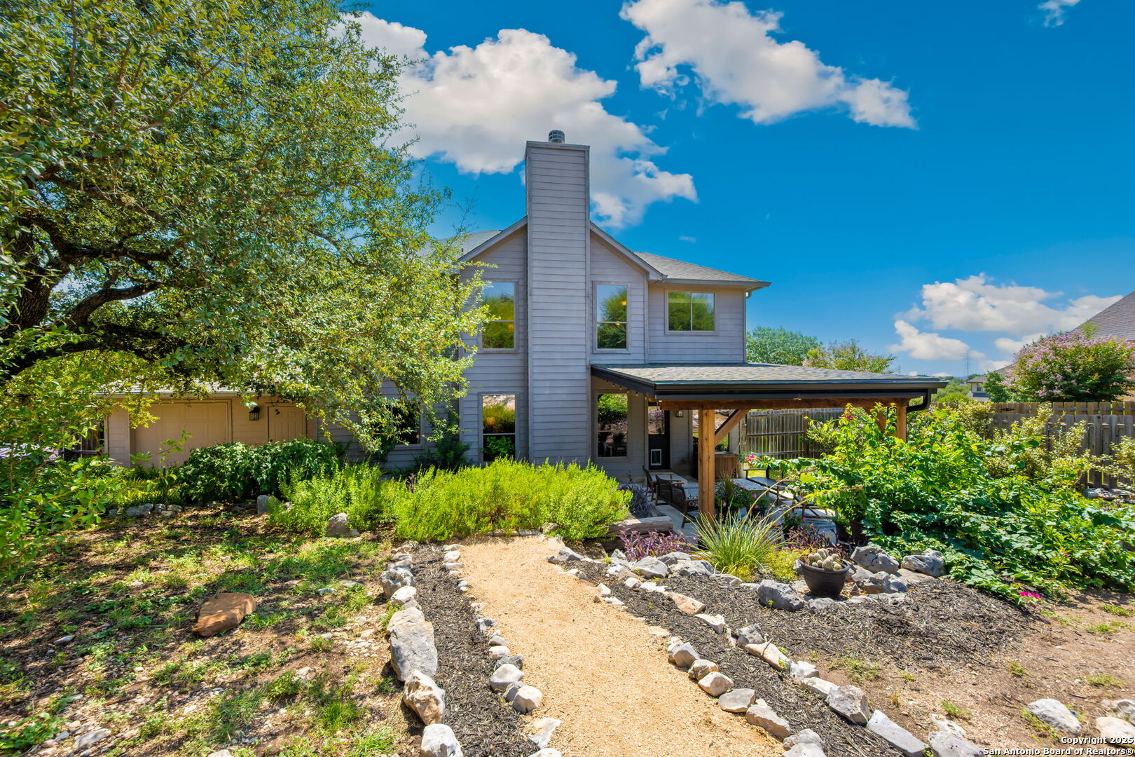 14507 John David Helotes, TX 78023 - Photo 46 of 49 a front view of a house with garden