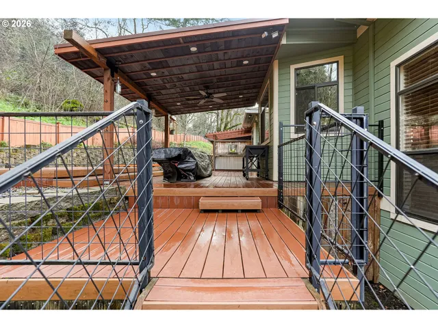 a view of house with backyard space and balcony