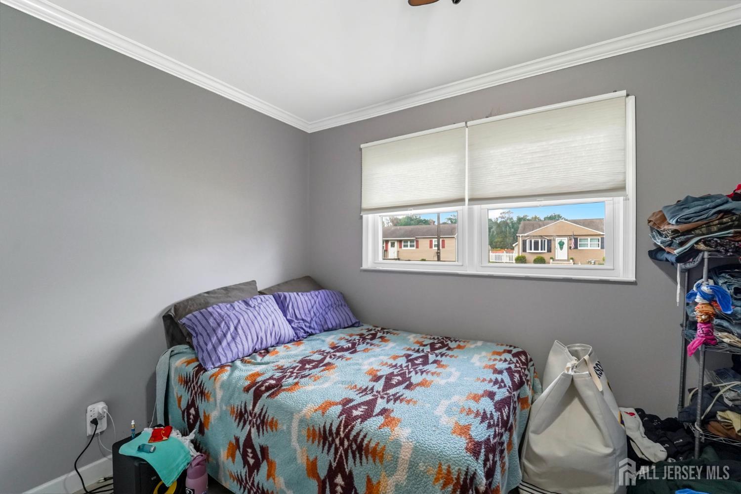 122 3rd Street Middlesex, NJ 08846 - Photo 11 of 24 a bedroom with a bed and a window