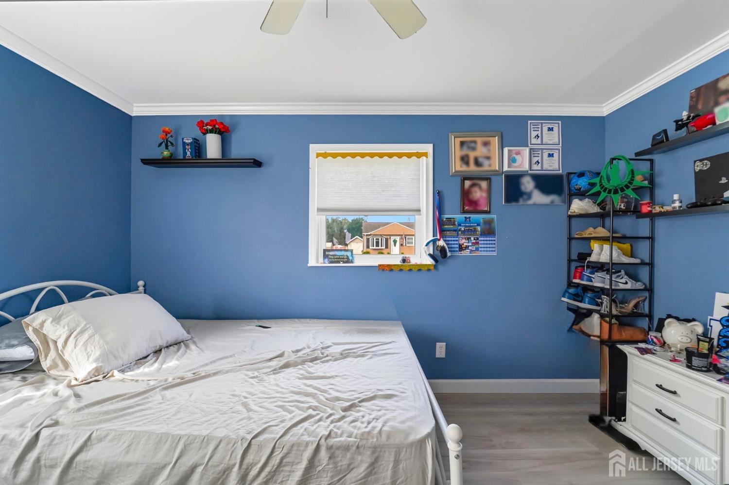 122 3rd Street Middlesex, NJ 08846 - Photo 14 of 24 a bedroom with a bed and book shelf