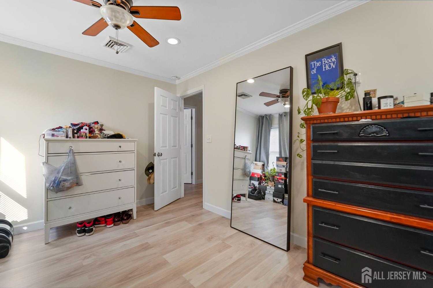 122 3rd Street Middlesex, NJ 08846 - Photo 17 of 24 a view of a workspace with furniture and wooden floor